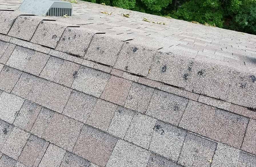 Ridge cap shingle damage after a tornado, documented with Midwest hail damage impacts