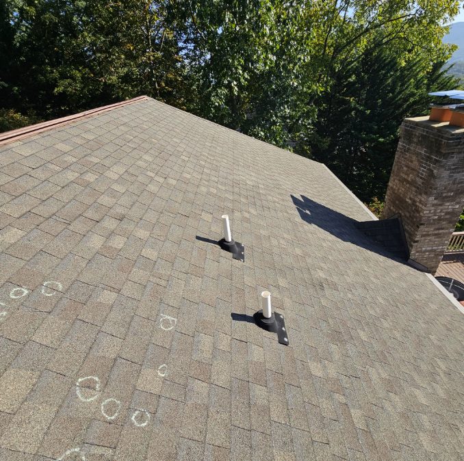 Midwest hail damage to a roof vent hood and plumbing pipe boot after a storm